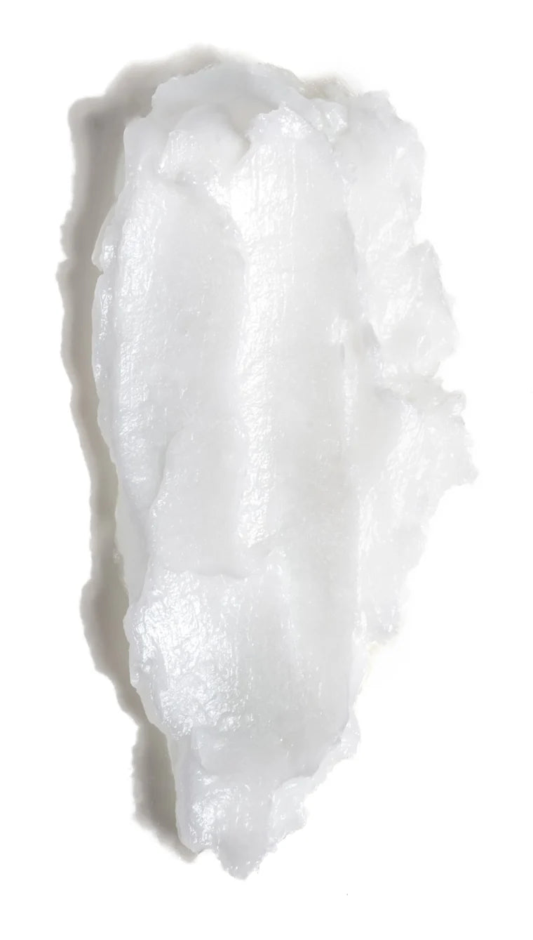 A swipe of HappyFat tallow cream showing its whipped, glossy texture